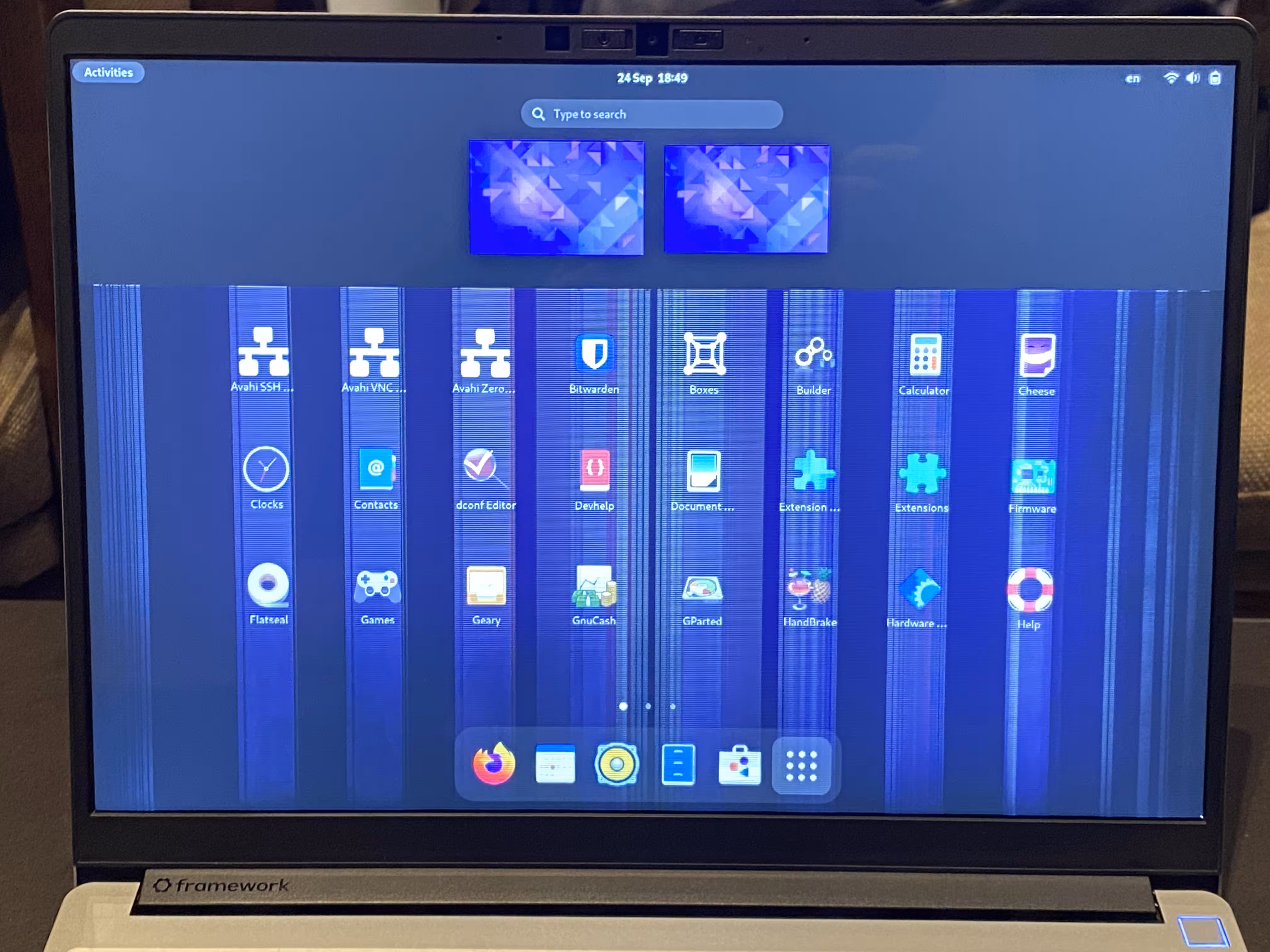A Framework Laptop 13 with two-thirds of its screen glitching