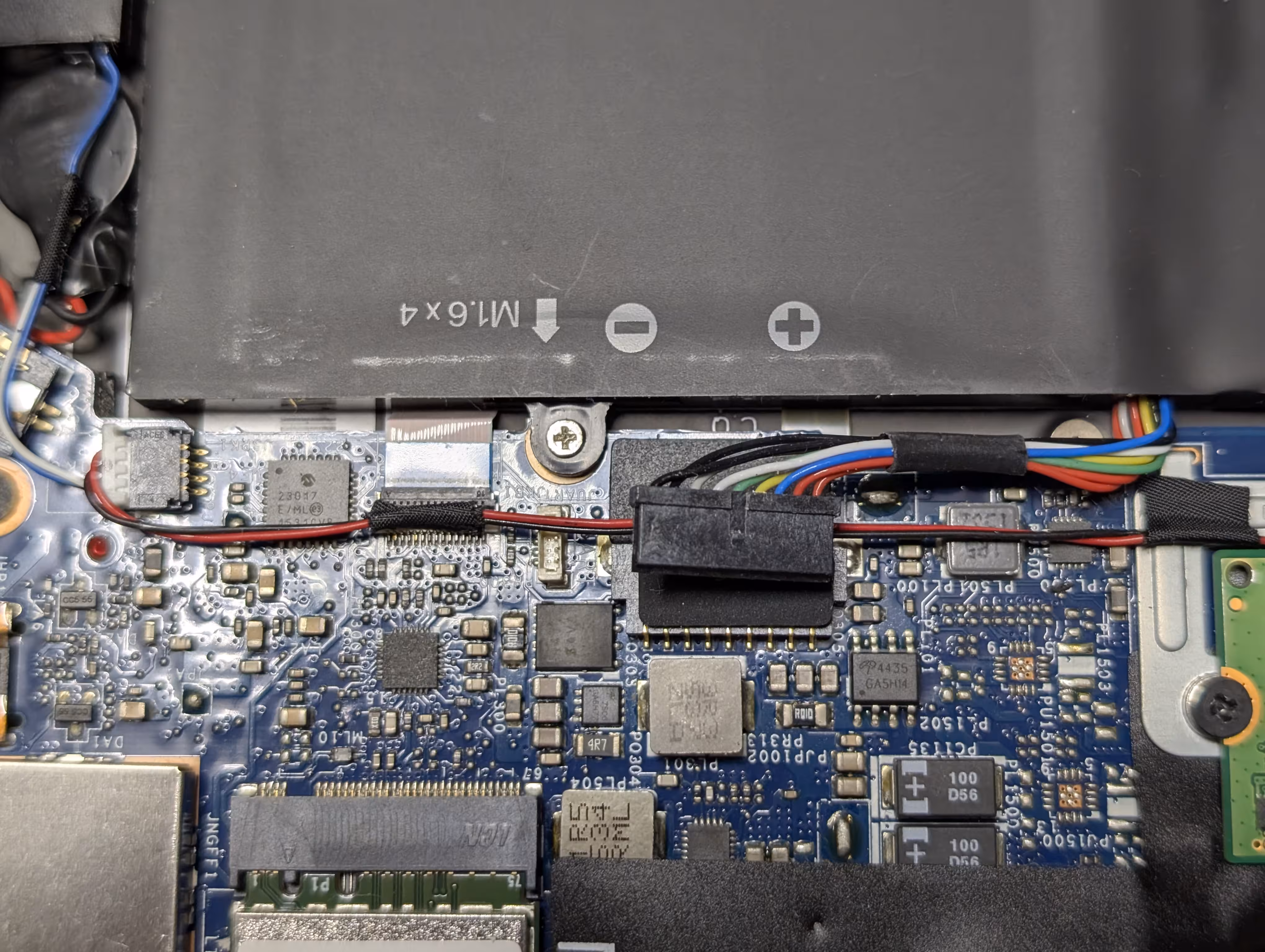 A disconnected battery connector inside the laptop
