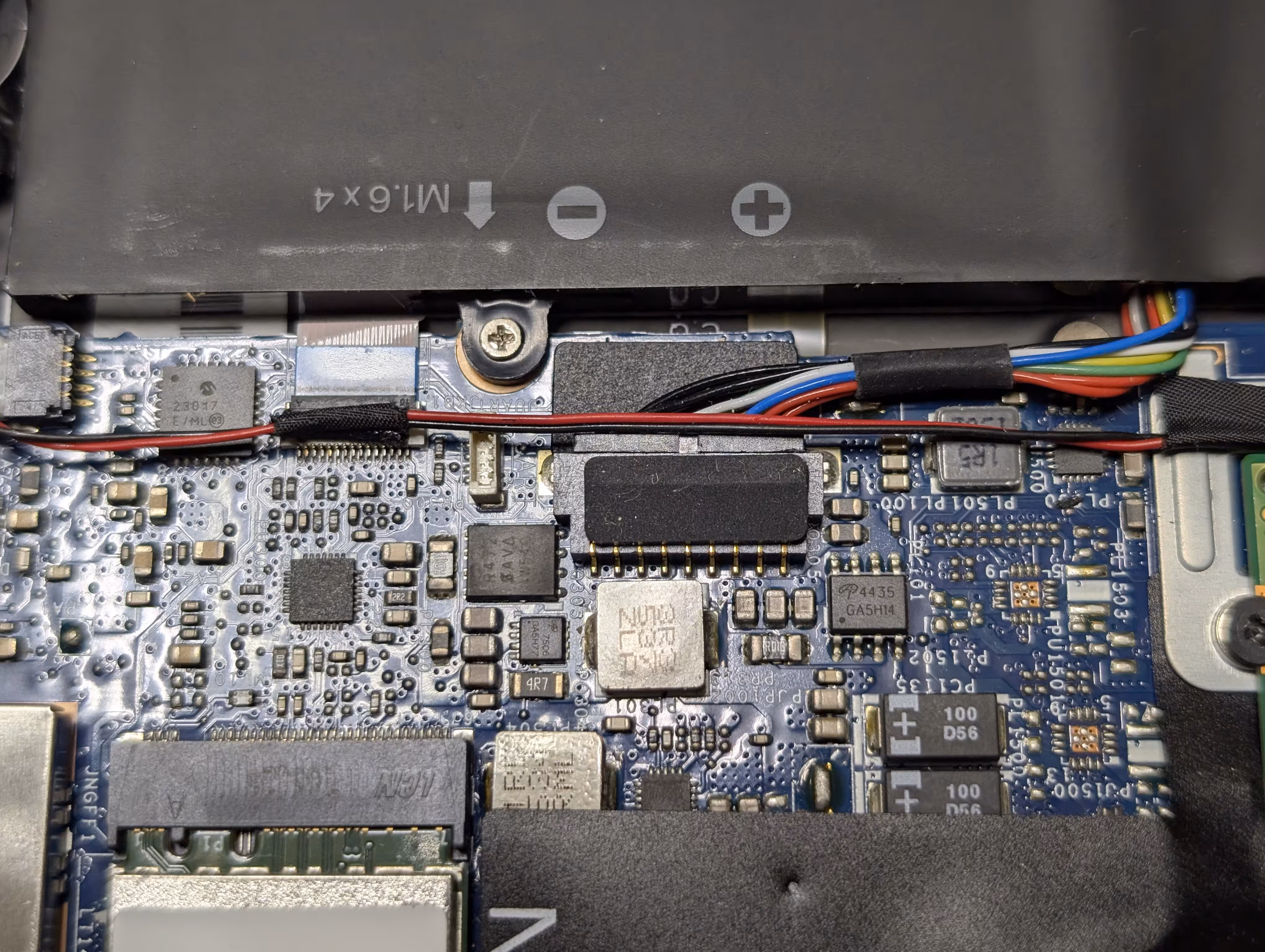 A battery connector inside the laptop, which is still connected