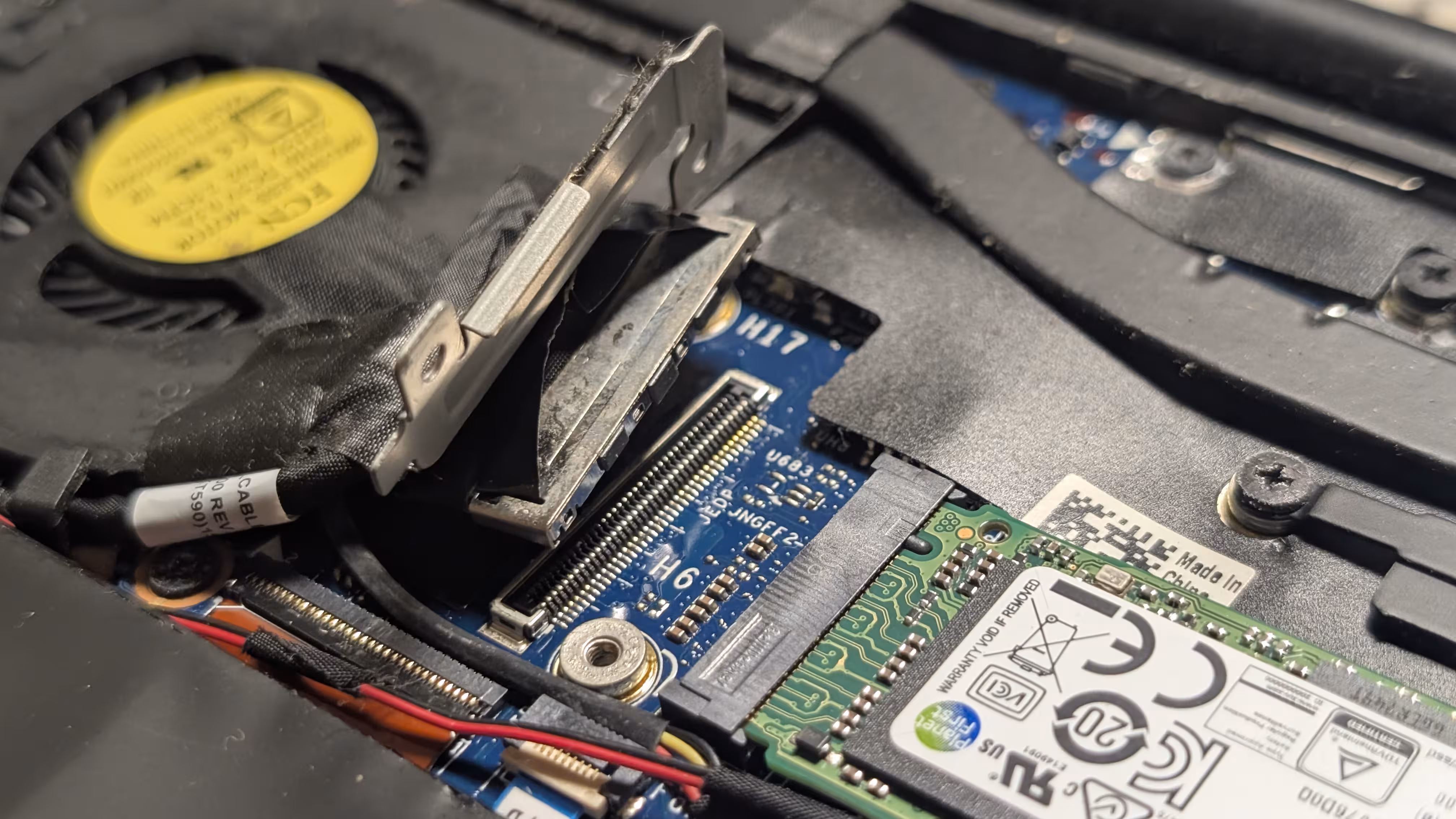 A display cable, disconnected from the board of the laptop